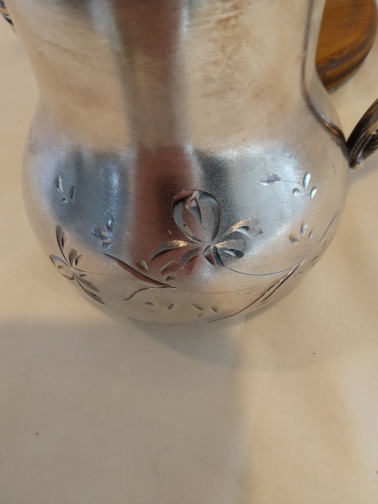 Beautiful small antique silver plated or silver pitcher.