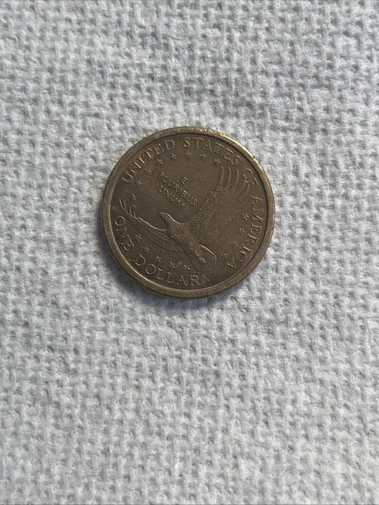 2000 D Sacagawea one dollar coin "wounded eagle" error coin .