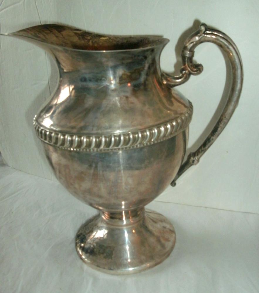 VINTAGE SILVER ON COPPER PITCHER, ENBLEM ON BOTTOM, 9 1/2" TALL