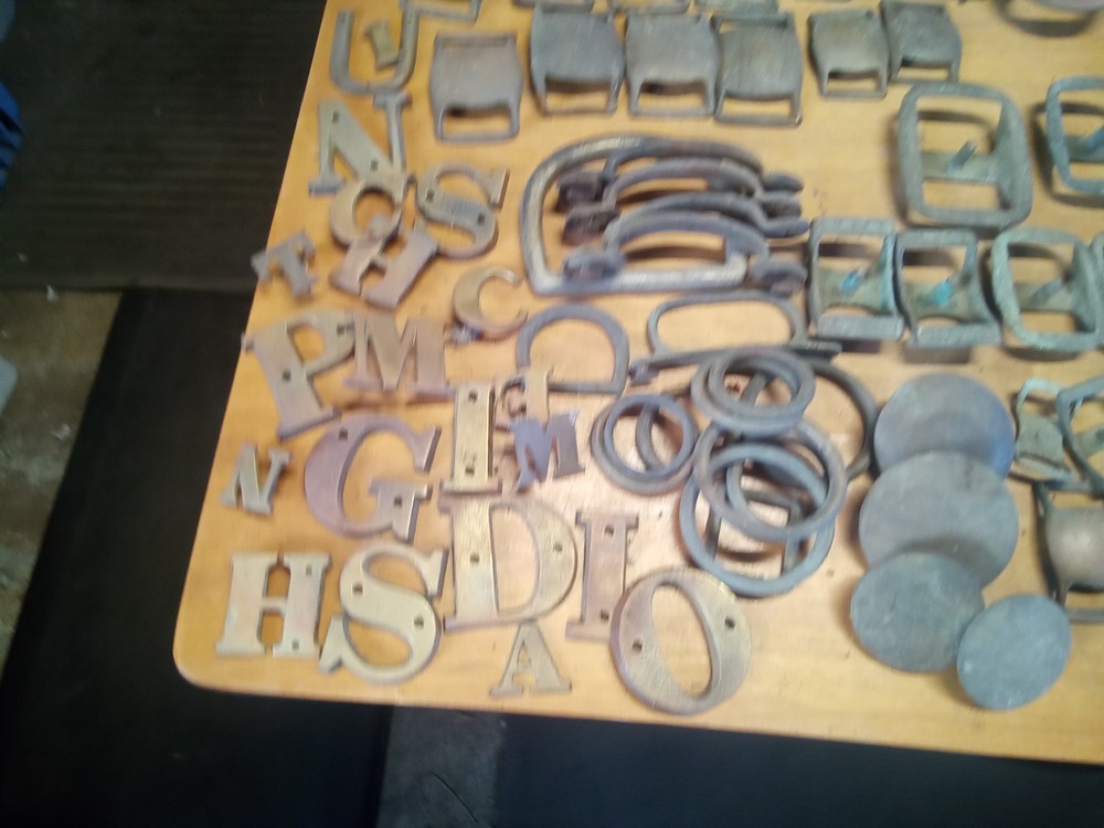 large assortment brass harness buckles