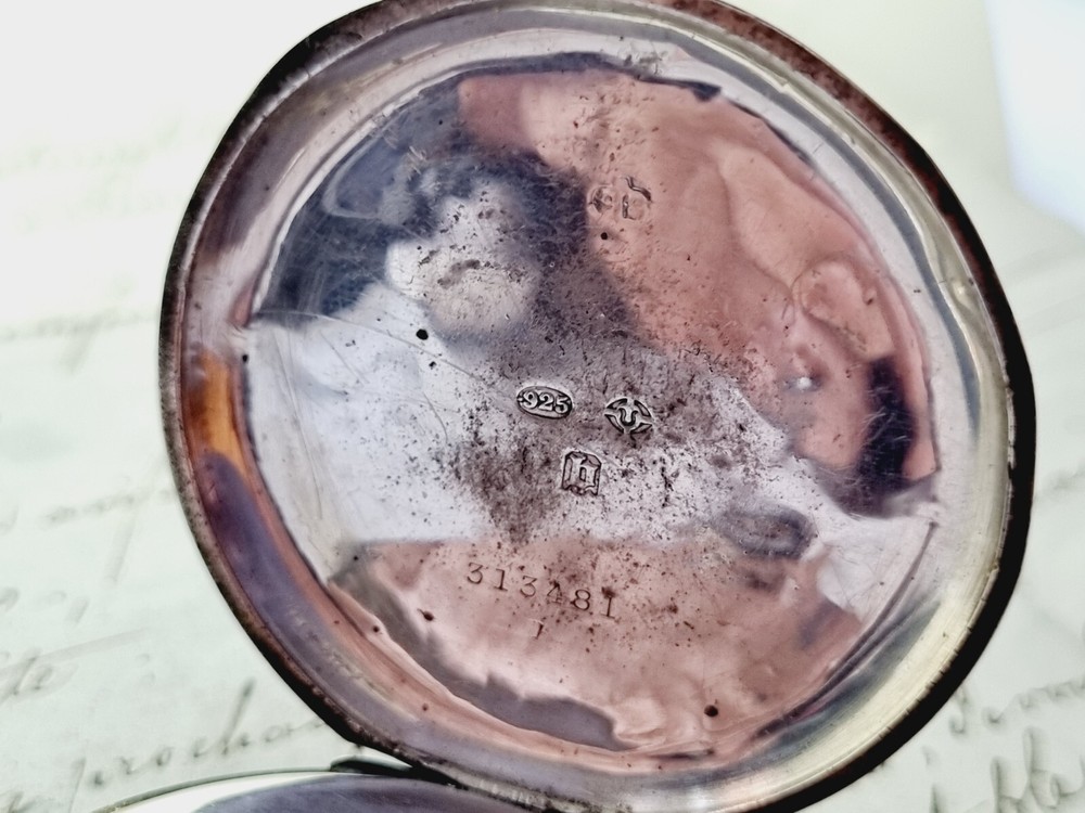 silver open face pocket watch