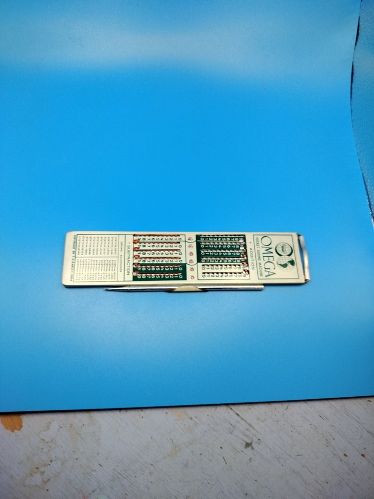 Vintage Omega Pocket Adding Machine , Collectible