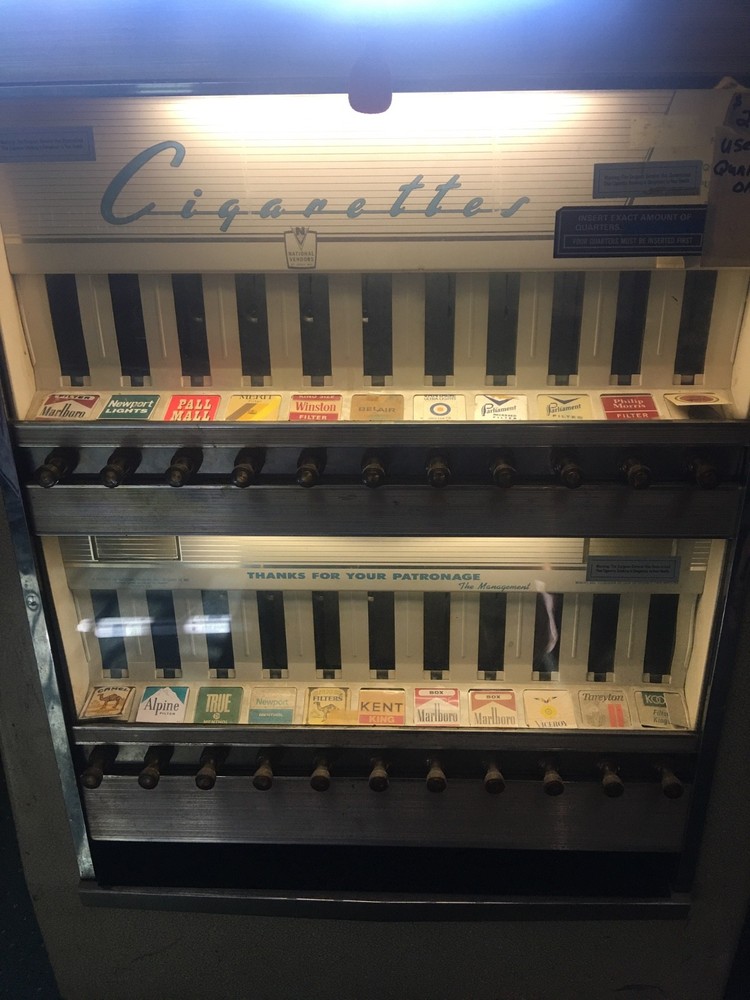 2- antique cigarette vending machine