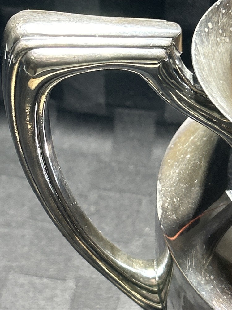 Vintage crescent silver plated water pitcher with ice lip