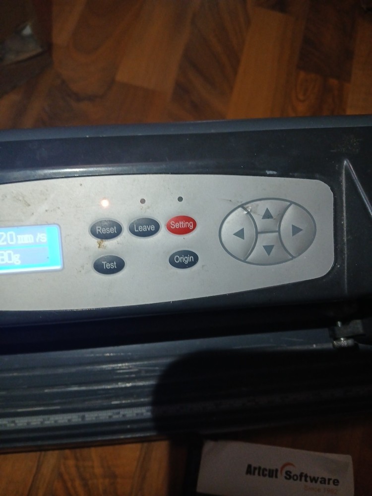 computer-controlled vinyl cutter machine Some Vinyl Material And Two Discs