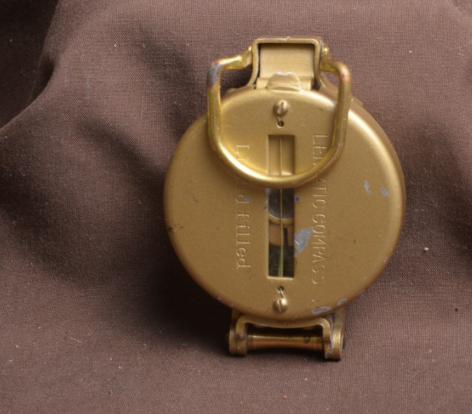 two lensatic compasses one with box