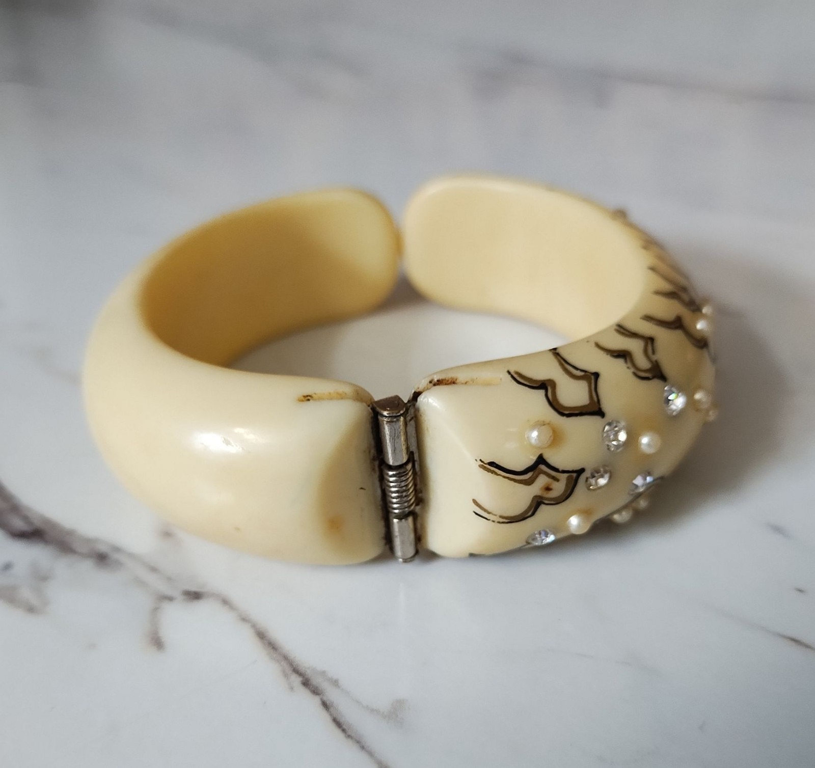Mid century Thermoset plastic ivory clamper bracelet with rhinestones