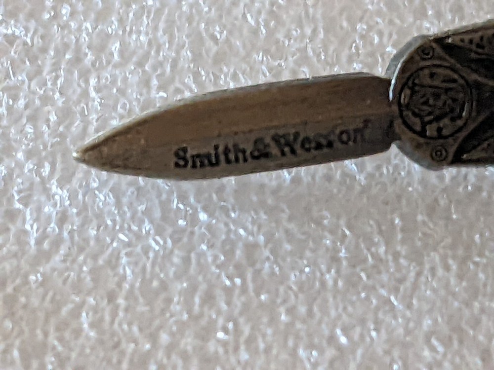 VINTAGE SMITH AND WESSON HAT/ LAPEL PIN