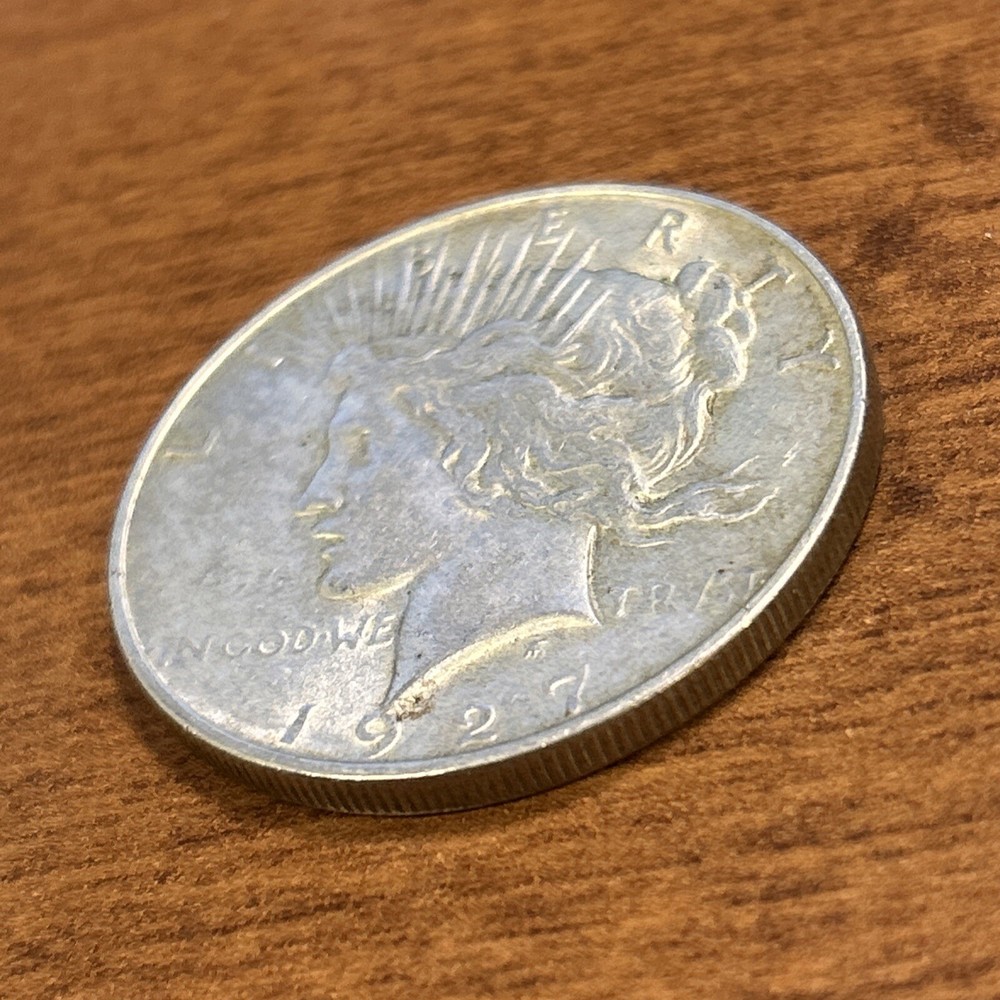 1927-D $1 Peace Silver Dollar AU+