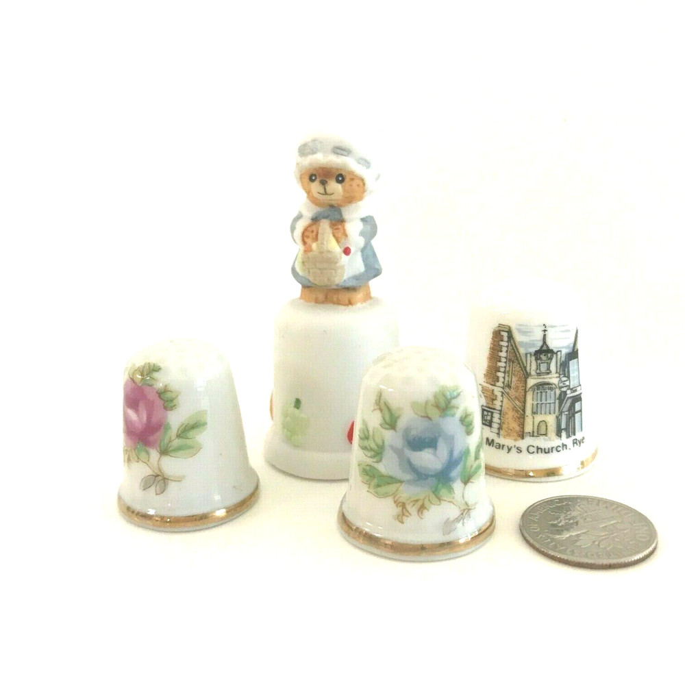 FOUR COLLECTABLE CERAMIC THIMBLES