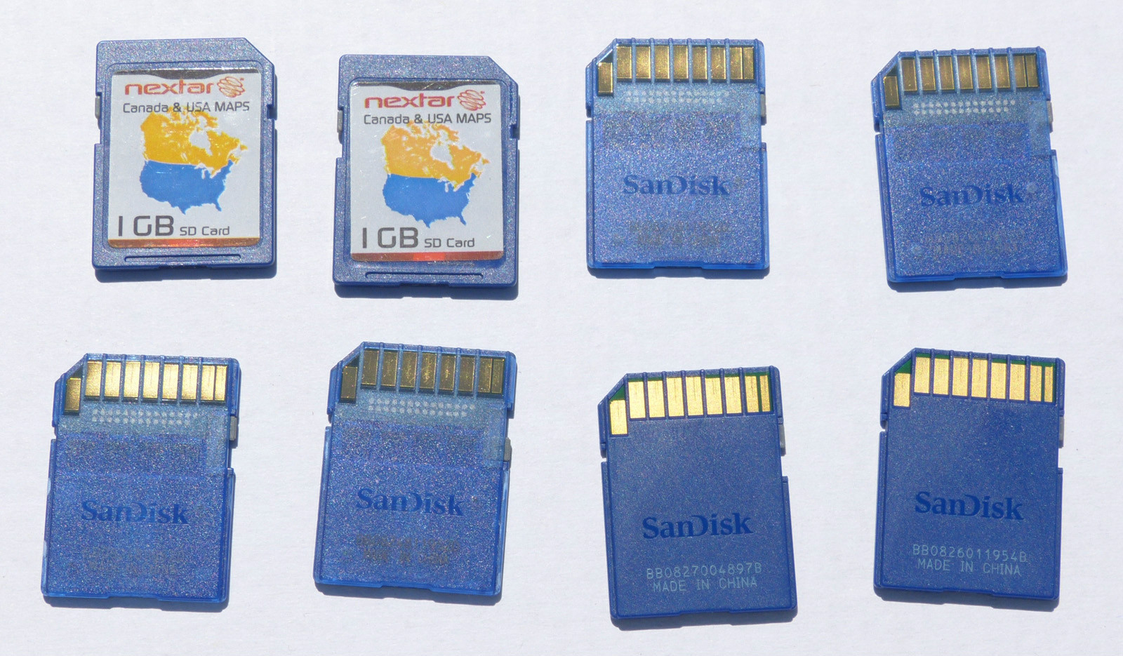 One (1) - genuine Sandisk 1GB SD card with Nextar gps USA & Canada maps