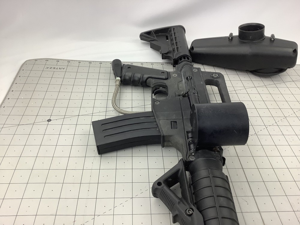 Tippmann Alpha black paintball marker with e trigger and cyclone feed untested