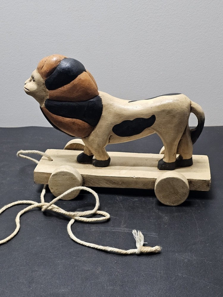 Antique Lion pull toy on wooden platform