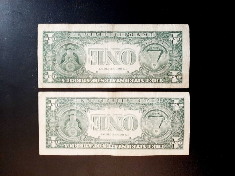 OPPOSITE MISCUT ERROR BILLS. LOT OF TWO $1 NOTES