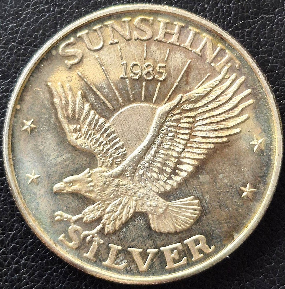 1985 1 oz .999 FINE SILVER SUNSHINE MINING *EAGLE* ROUND with Toning
