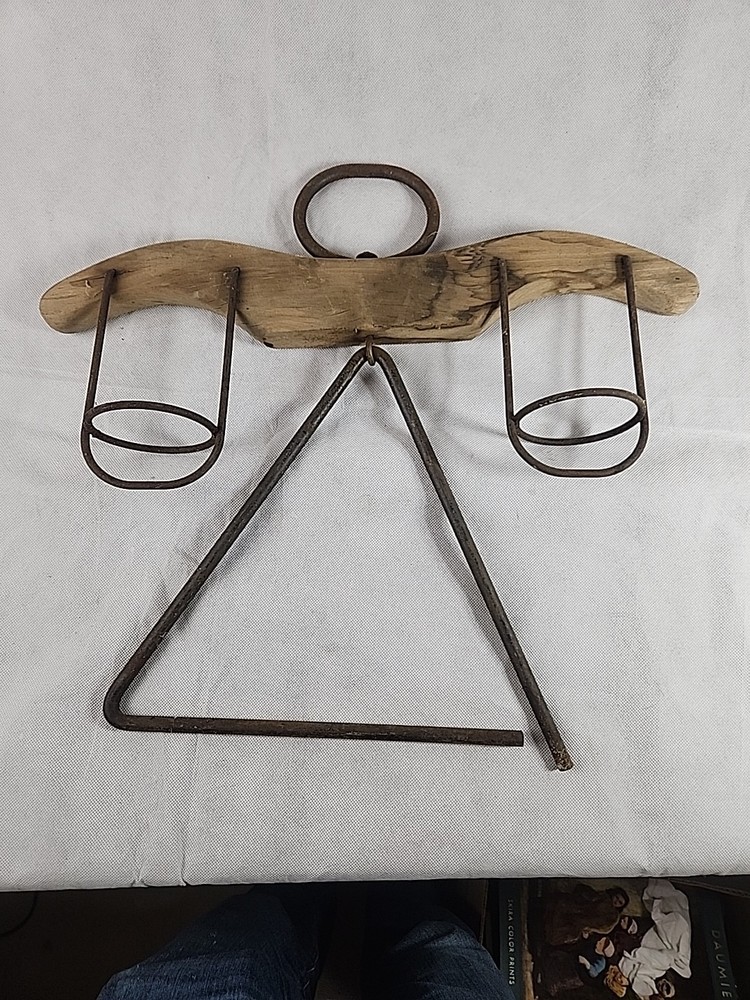 This object is a rustic, handmade angel-shaped decoration With Dinner Bell