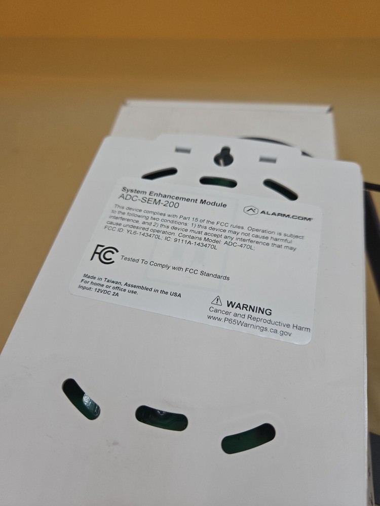 ALARM.COM ADC-SEM200 SYSTEM ENHANCEMENT MODULE