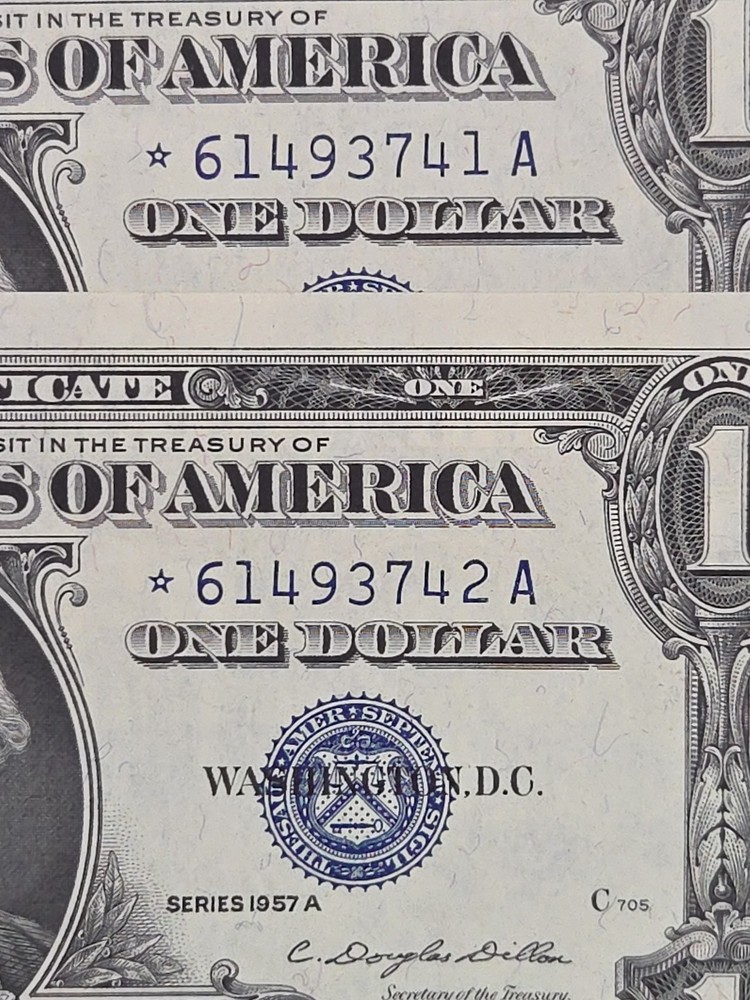 1957-A 2 consecutive silver cert. Dollars. Nice Unc Stars