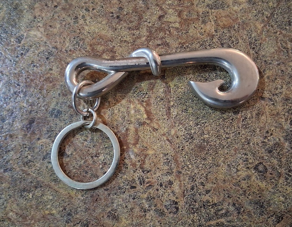 +1This item is a stainless steel fish hook keyring, often functioning as a...