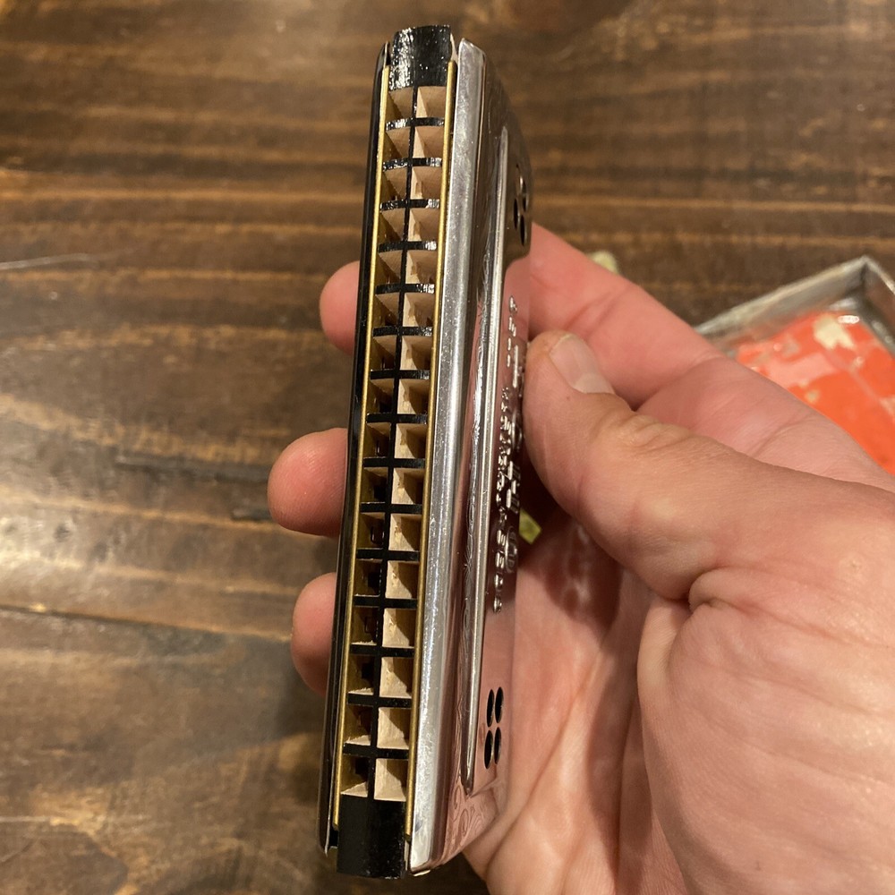 two M Hohner Echo harmonicas with rough boxes dofferent styles