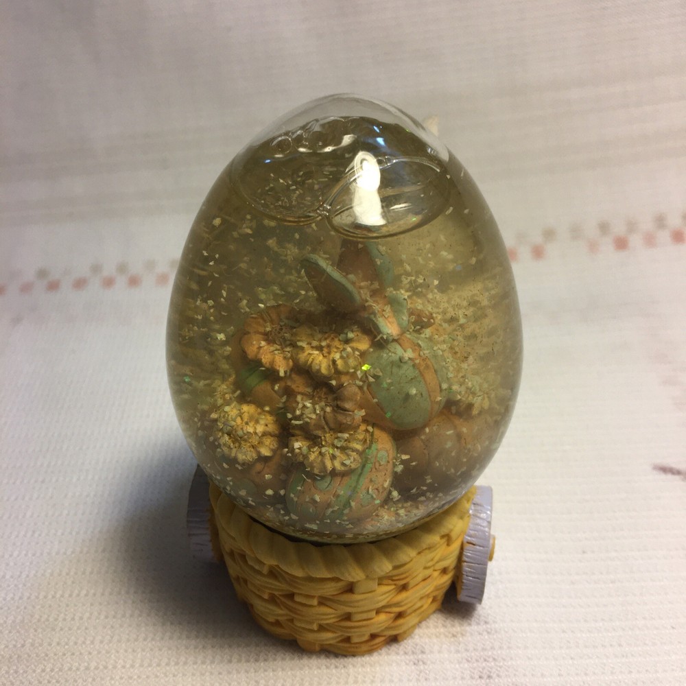Rabbit Pulling Cart Snow globe Filled With Easter Eggs. Super Cute