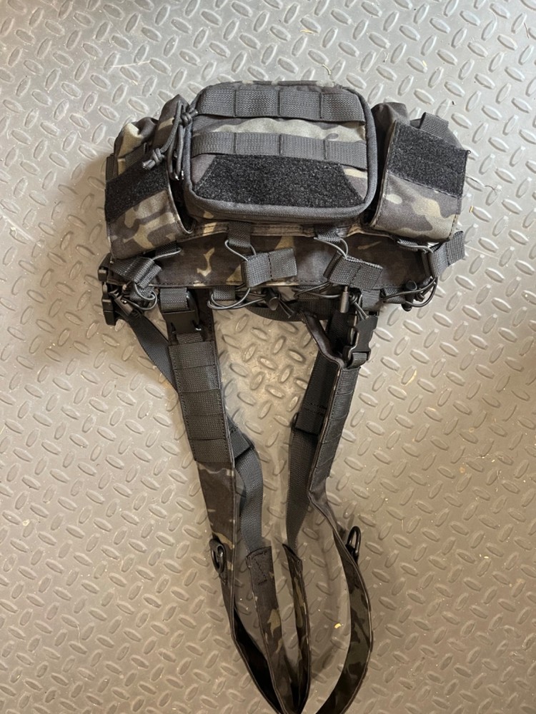 Black multicam chest rig made by one Tigris.