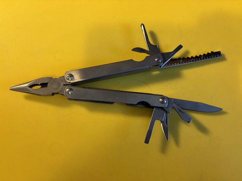 3-Pocket Multi-Tool with 9 Tools - Pliers Cutters Opener Flat Head Scissors L33