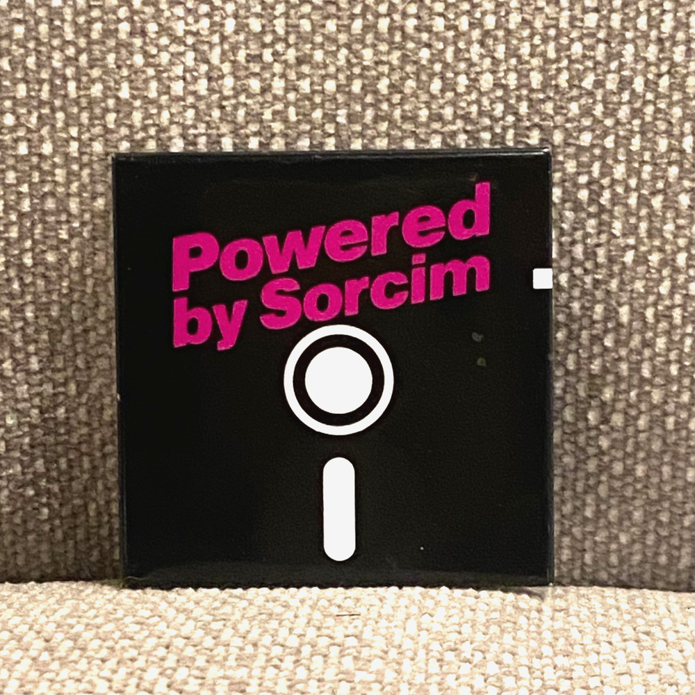 Vintage Powered by Sorcim Pinback Button Floppy Disk Software Tech Advertising