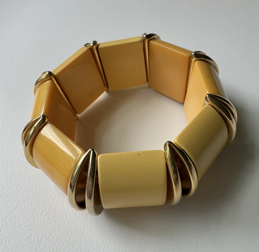 Nice butterscotch bakelite expandable bracelet with deco gold inserts