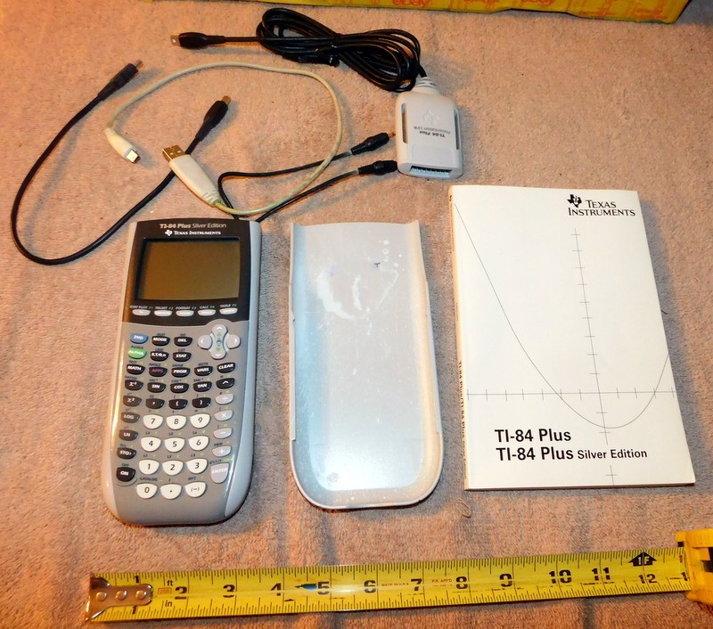 Texas Instruments TI-84 Plus Silver Edition Graphing Calculator & Manual Cords