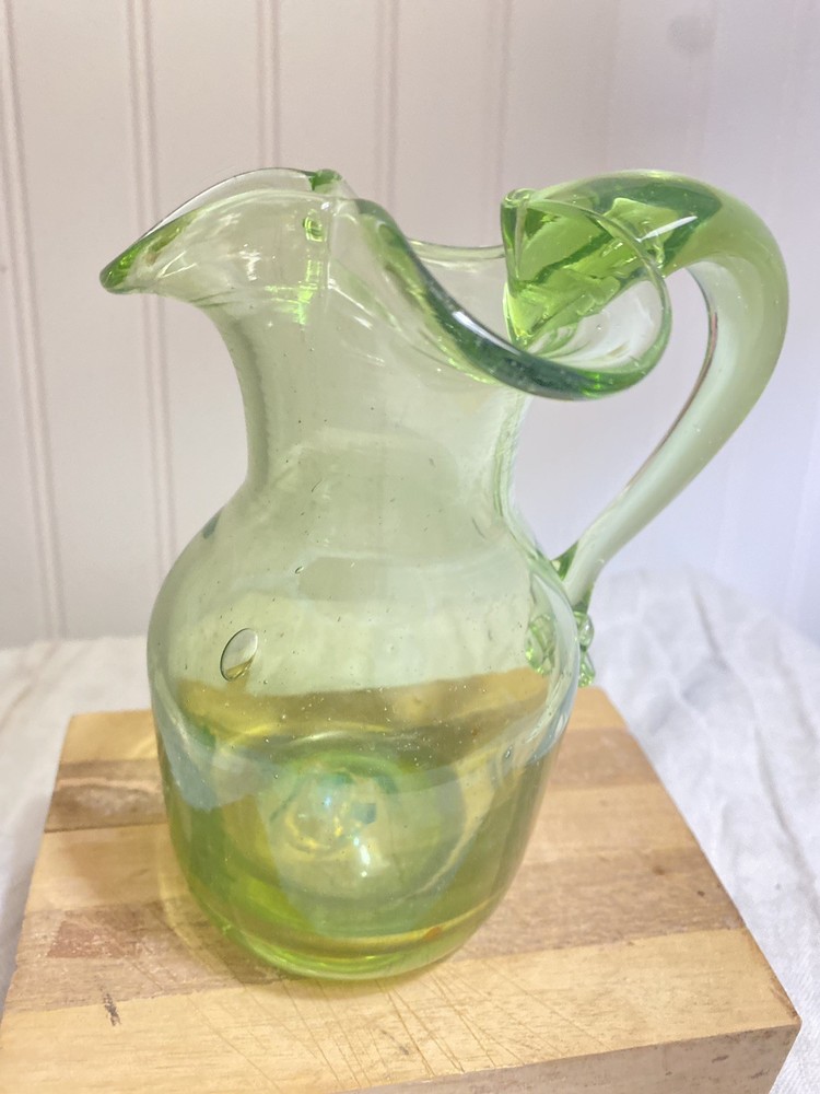 green glass pitcher vintage