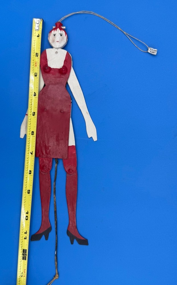 PAINTED METAL "JUMPING JILL" PULL STRING TOY FIGURE