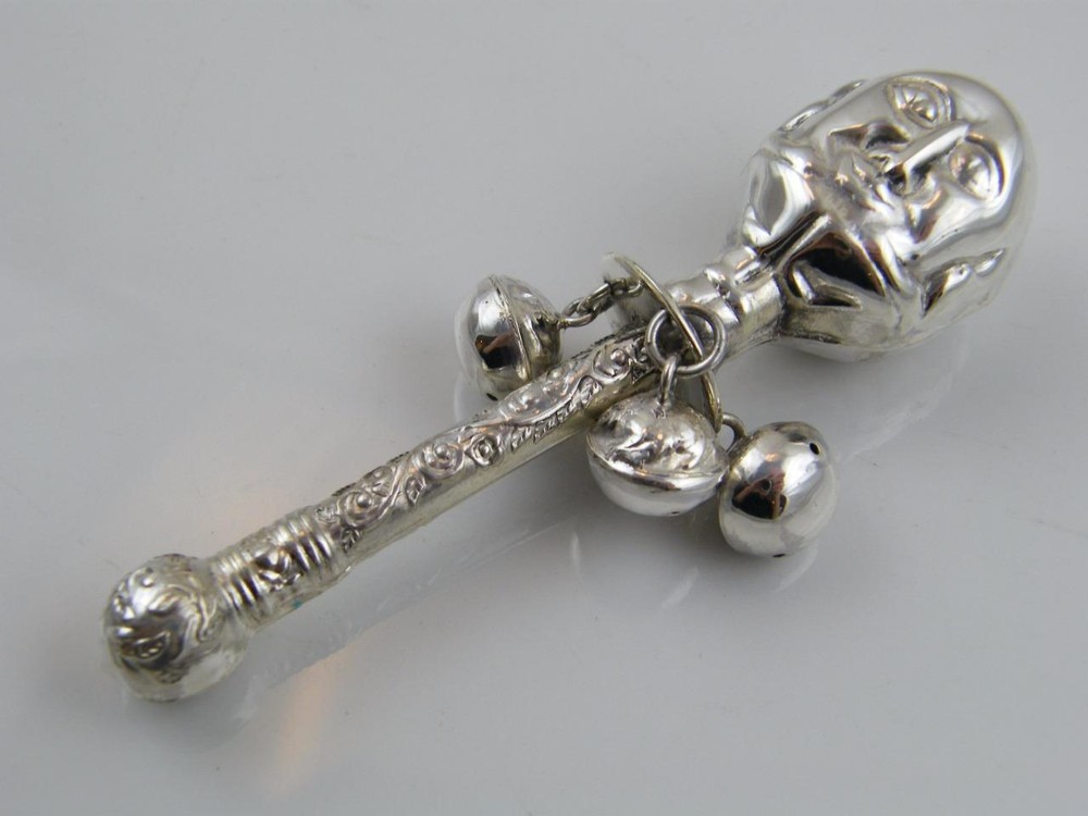 EMBOSSED ‘TWO FACE’ STERLING SILVER BABIES RATTLE