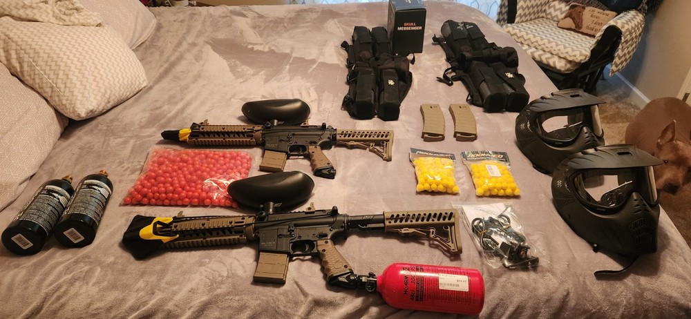 2 paintball guns with accessories