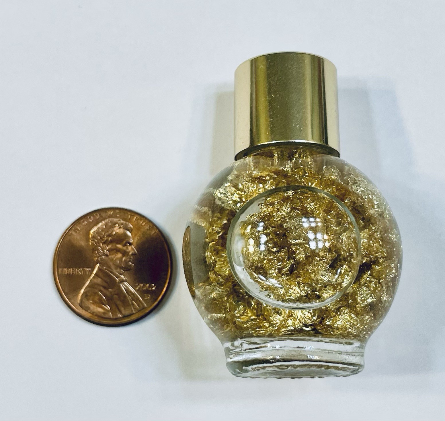 Pure Gold Leaf Flakes in a Sealed Bottle