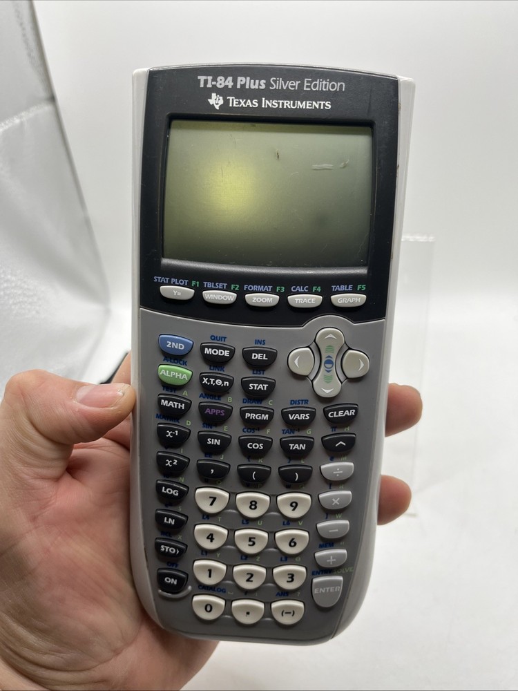 Texas Instruments TI-84 Plus Graphing Calculator - Silver Edition Works