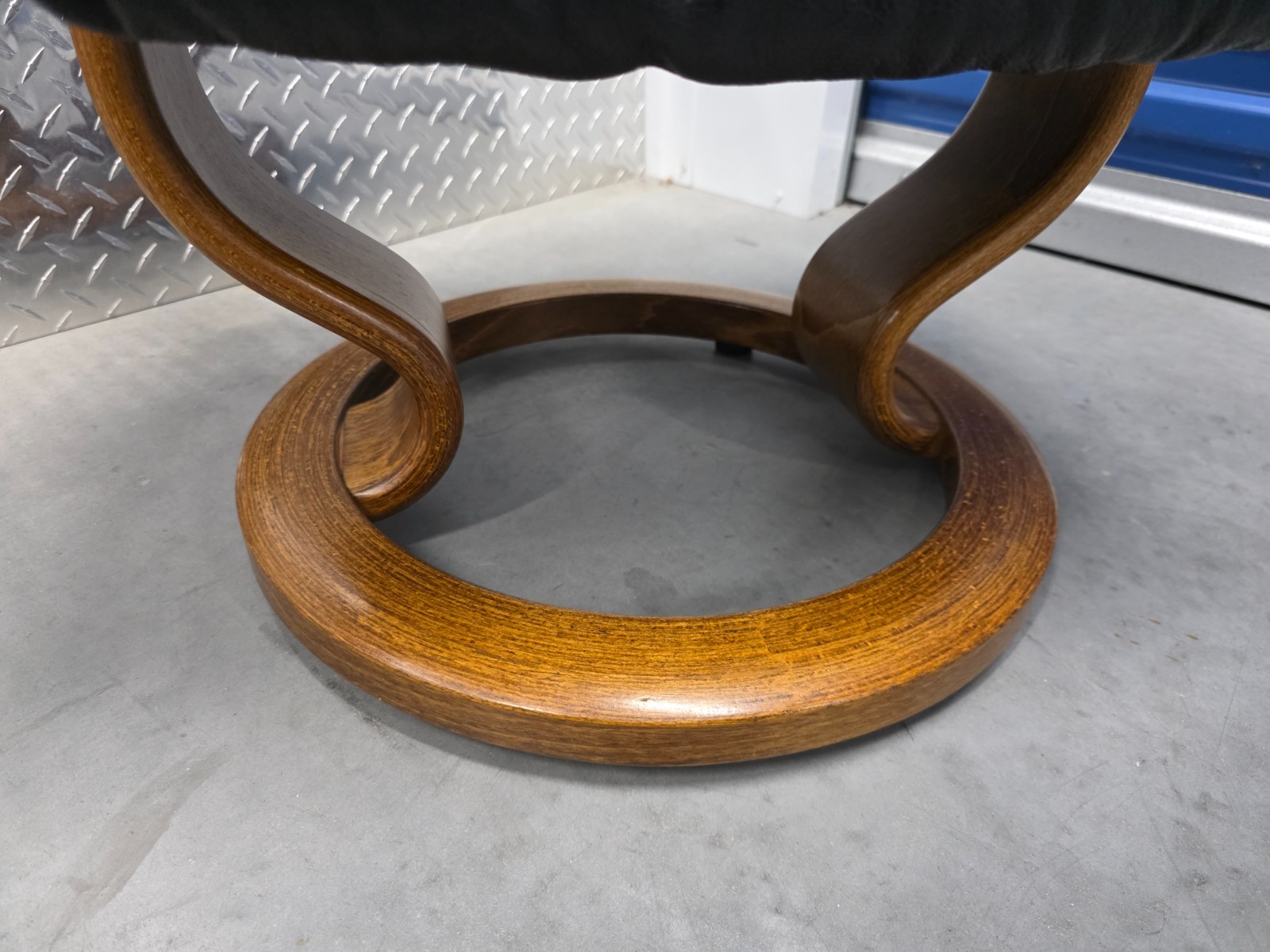 Ekornes Stressless Black Colored Leather Ottoman | Teak Stained Wood Base