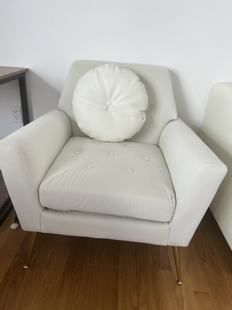 White quilted fabric armchair