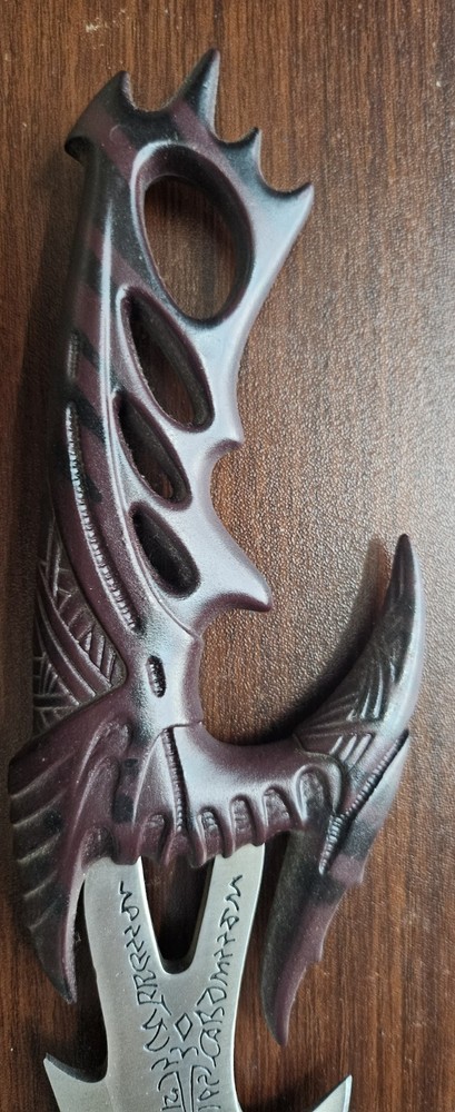 Fantasy Dragon Claw Dagger with Intricate Handle Design