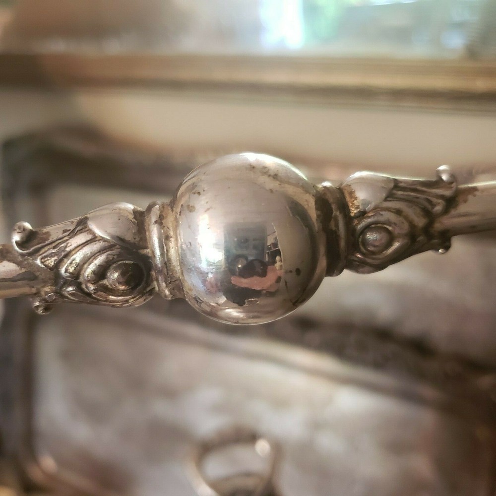 James W. Tuft silverplated tilting water pitcher. 20" tall. 