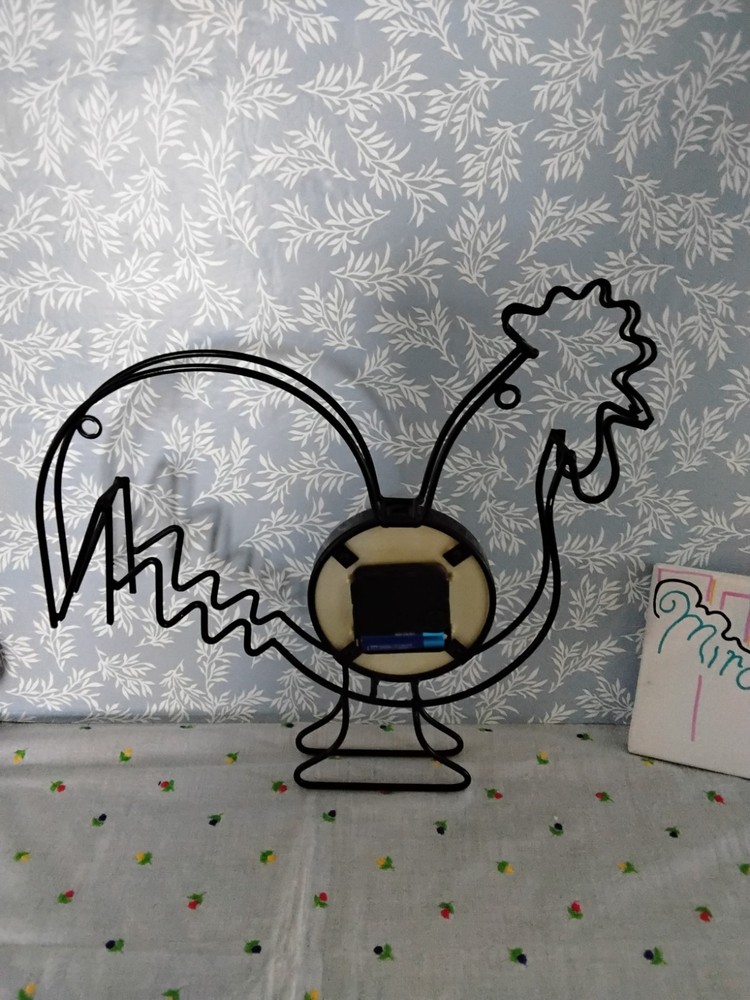 Black Metal Rooster-Shape Frame With Circular Clock Face .