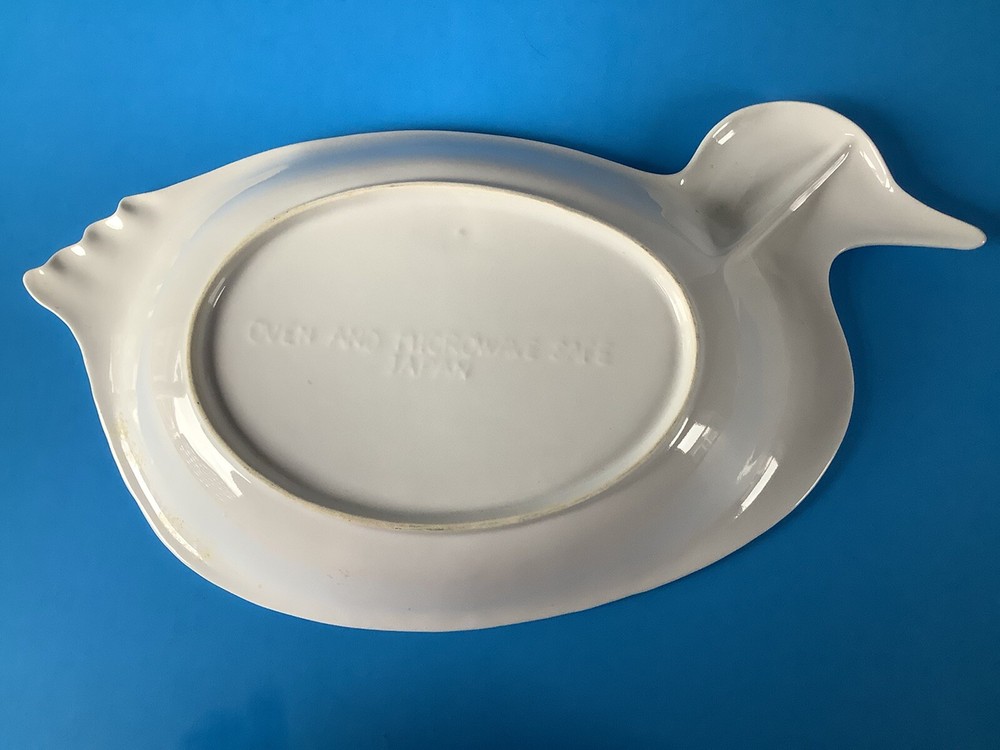 White ceramic duck-shaped platter