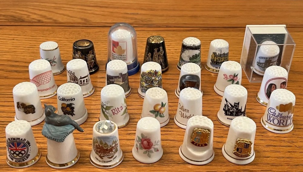 27 CERAMIC THIMBLES