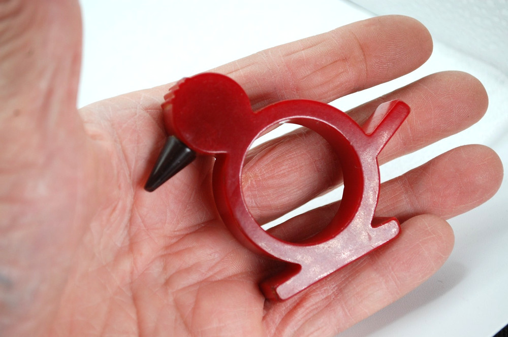 catalin bakelite napkin ring red birt black beak