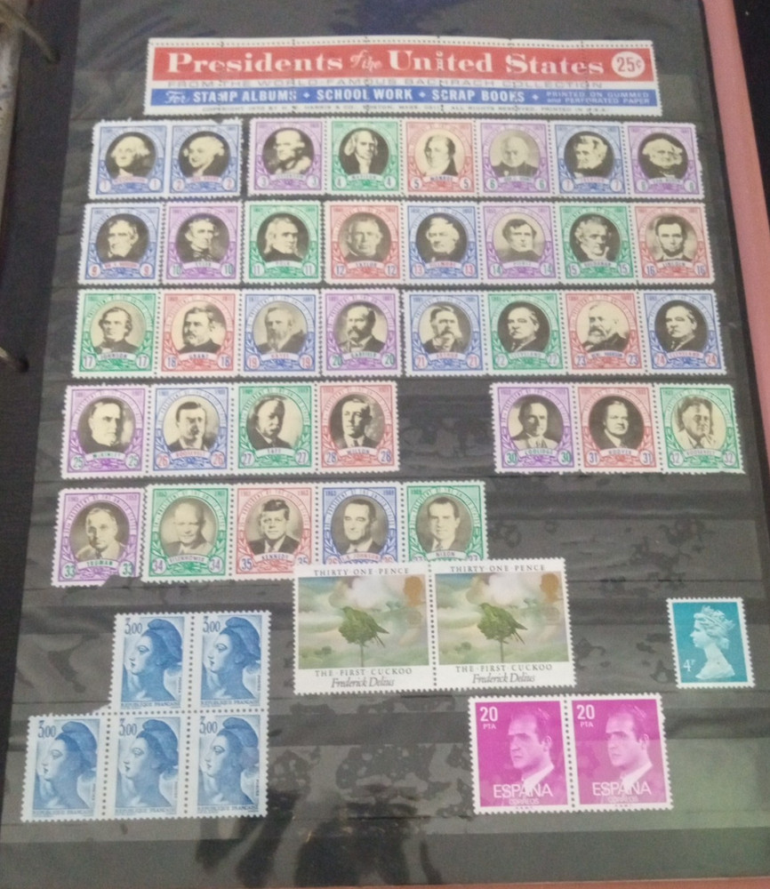 2" 3 ring binder w/ 5 pages of stamps over 100 usable stamps mostly US