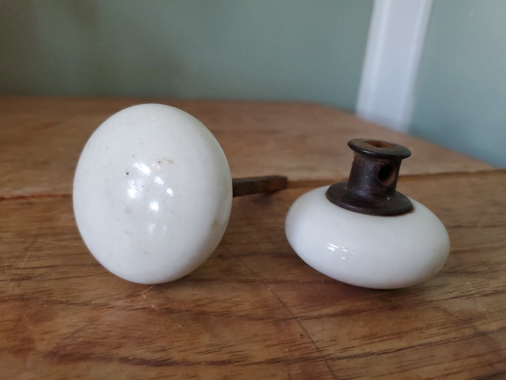 Two Antique Victorian White Porcelain Door Knobs With Iron Stem
