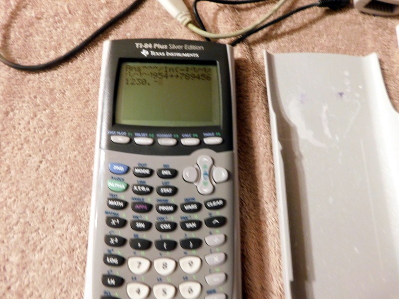 Texas Instruments TI-84 Plus Silver Edition Graphing Calculator & Manual Cords