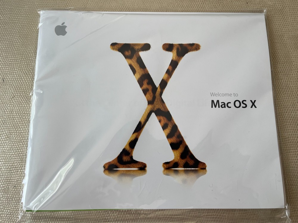 Mac OS X 10.2 Jaguar install discs + developer tools disc and Mac OS X manual