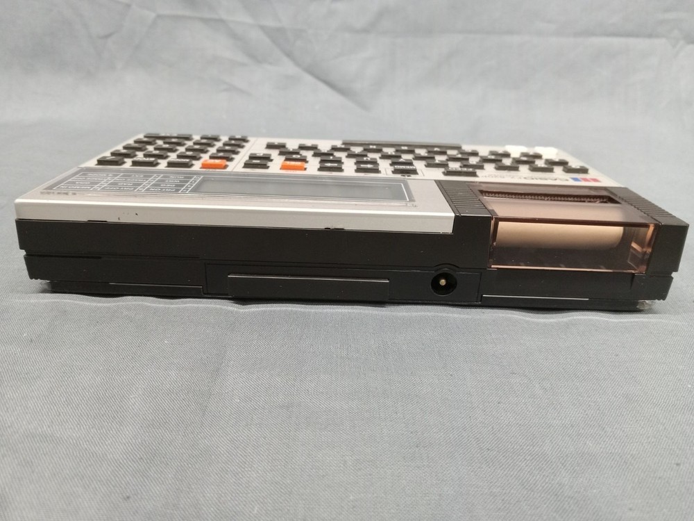 CASIO FX-820P Personal Computer With Charger Case and Manuals FULLY FUNCTIONAL!