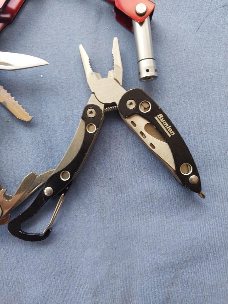 4 small multitudes with pliers knife scissors screwdriver's